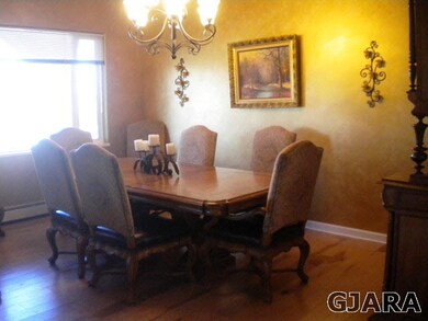 Formal dining that is open for easy entertaining.