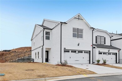 View of front of property with driveway, fence, bo