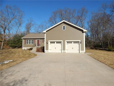 Two car garage and concrete stamped driveway.