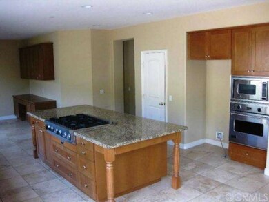 Kitchen w/ nook & desk. Viking appliances. White d