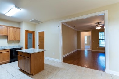 Kitchen showing the pantry and laundry room  with 