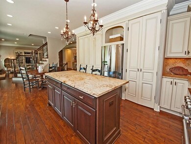 BEAUTIFUL CUSTOM CABINETS ADORN THIS OPEN FLOOR SP