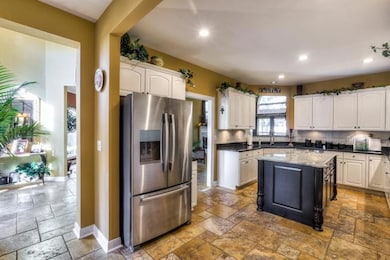 This enormous 23x10 kitchen has also been recently updated to include new granite, granite sink, all new stainless appliances, low voltage recessed lighting and center island - $18,000!!! This is like a new home but better.