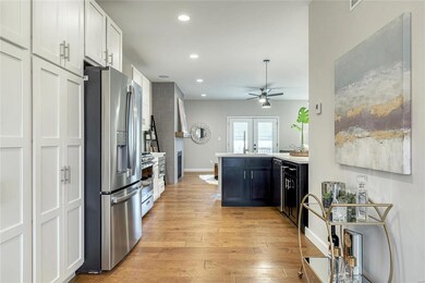Dining area leads into the open kitchen. Recess li