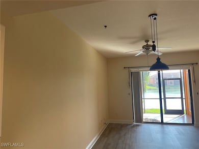 Empty room with ceiling fan, baseboards, and wood