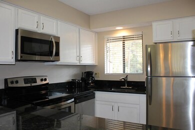 6.a. View to kitchen from breakfast bar