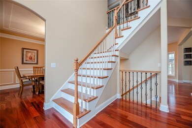 Two story foyer with a view of the formal dining r