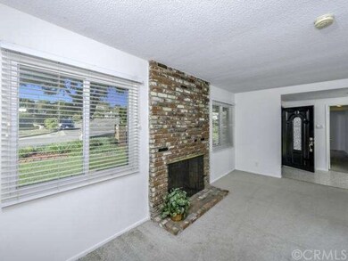 Formal Living Room with another view of Brick Fire