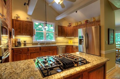 Alternate view of the kitchen with gas cooking and