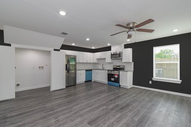 living room overlooking kitchen, dining area and l
