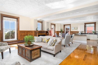 Open living area, dining area and kitchen.