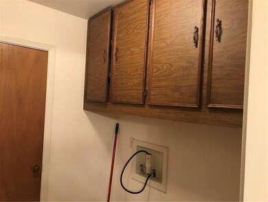 Laundry room area with door leading to huge pantry