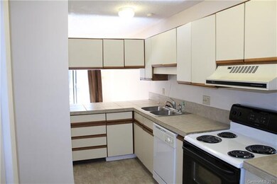 Clean, complete kitchen has pass-through into the 