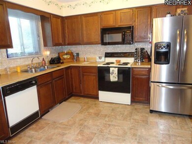 Kitchen with newer vinyl floor and butcher block c
