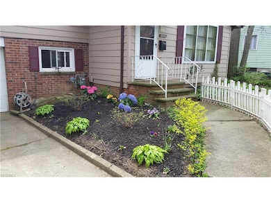 Front entry. Seller working on the landscaping.