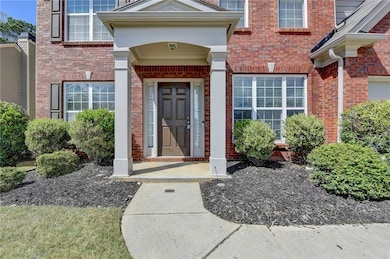 Entrance to property with brick siding