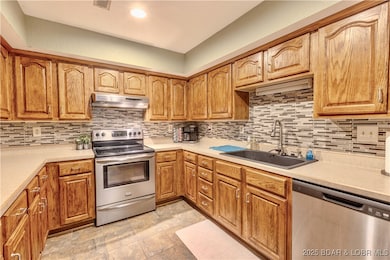 Functional kitchen with newer appliances.