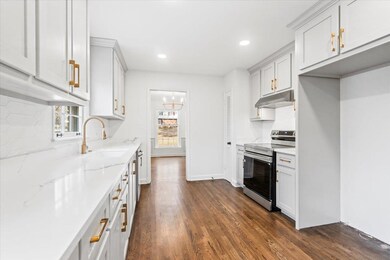 Kitchen featuring decorative backsplash, a wealth 