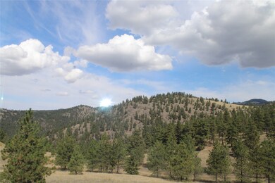 View of mountain backdrop featuring rural landscape