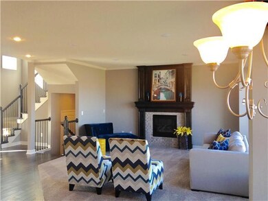 Gas fireplace and high ceilings in great room.
