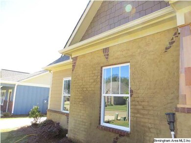 Lovely brick accent on exterior front of home.