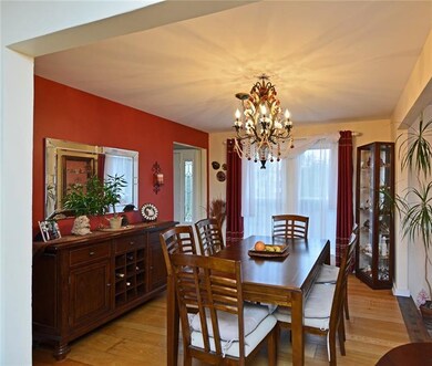 The dining room also includes an ornate chandelier