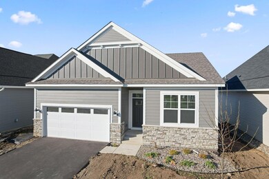 What a cutie- James Hardie siding elevates the front architecture along with beautiful stone accents