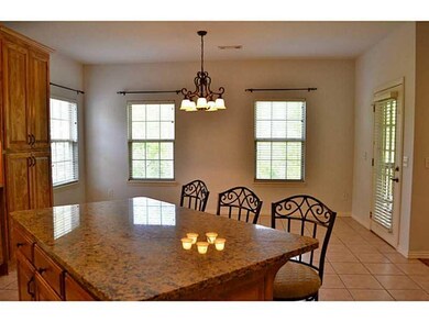 Dining Room. Looking from the island in the kitchen to the eat in kitchen..it s BIG with a door to the upper deck