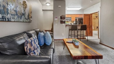 Living room featuring light carpet
