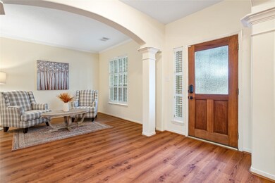 To right is a spacious, formal living, or use it as a study/home office!