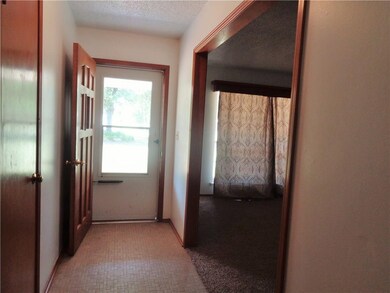 Tiled entry. hall closet and formal living room entry.