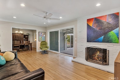 Living Room
Front door with glass inserts
Energy efficient dual pane windows
Smooth ceilings 
Crown molding
Ceiling fan
LED recessed lights
Floor-to-ceiling fireplace in white-painted brick
Oversized sliding glass door leading to the backyard