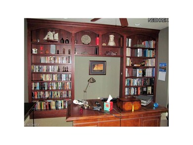 Office/den with beautiful built-ins and bay window