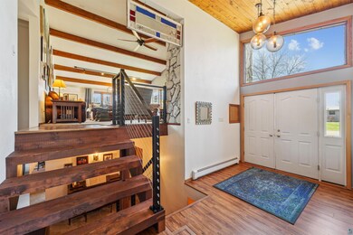 Double doors, transom window, two closets, and soaring ceiling