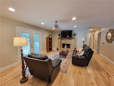 French Doors with Encased Blinds Lead to Golf Gree