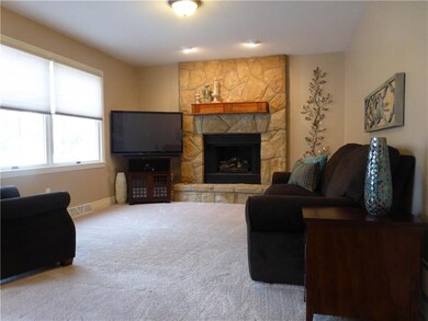 Natural Stone warms the Family Room Scene around t