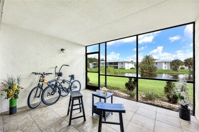 Sunroom featuring a water view