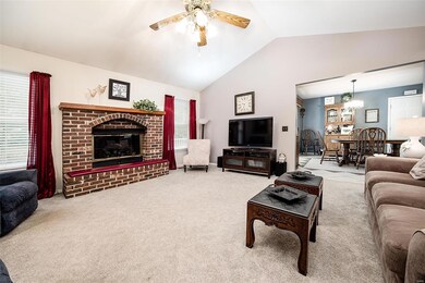 Living room with brick fireplace