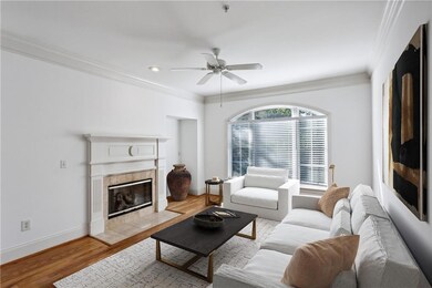 Living room with light wood-type flooring, crown m