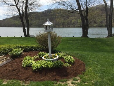 Great view of lawn, river and small garden.