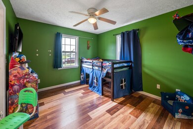 The 1st bedroom features finished wooden floors, ample natural light & ceiling fan! 71 Rebecca Drive Manchester, TN 37355