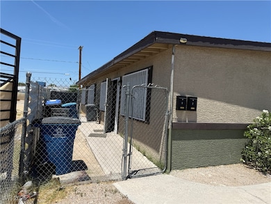 View of home's exterior with a gate and stucco sid