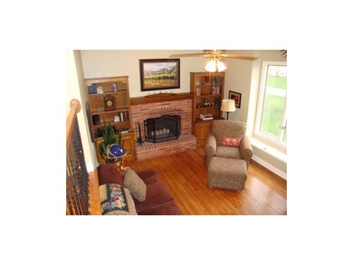 IMMACUTE LIVING ROOM FEATURES FIREPLACE AND BUILT-