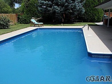 Summertime fun in back yard with inground pool.