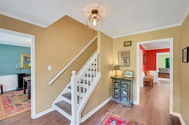 Open foyer looking into dining room and office on 