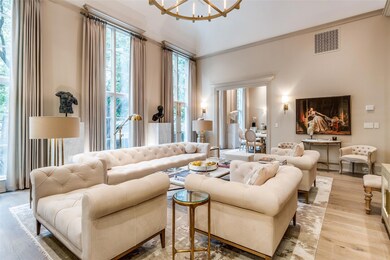 Living area featuring visible vents, light wood-st