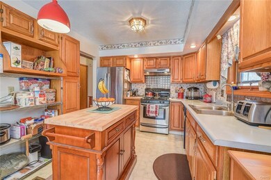 Kitchen with plenty of cabinets. Island stays- wir