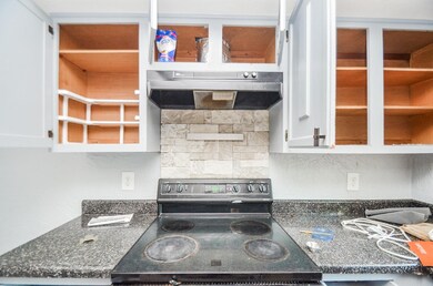 The stove is placed between generous counter space