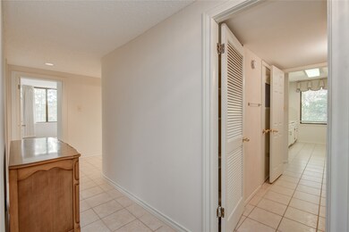 Foyer leads to hall on the left and pass-through t