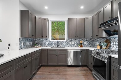 Kitchen featuring appliances with stainless steel